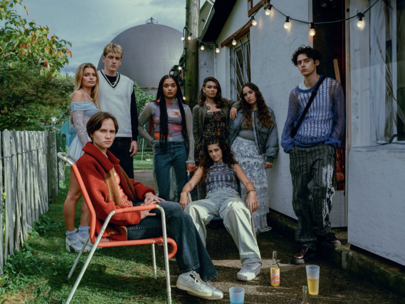 Mila and her friends sitting in the front yard