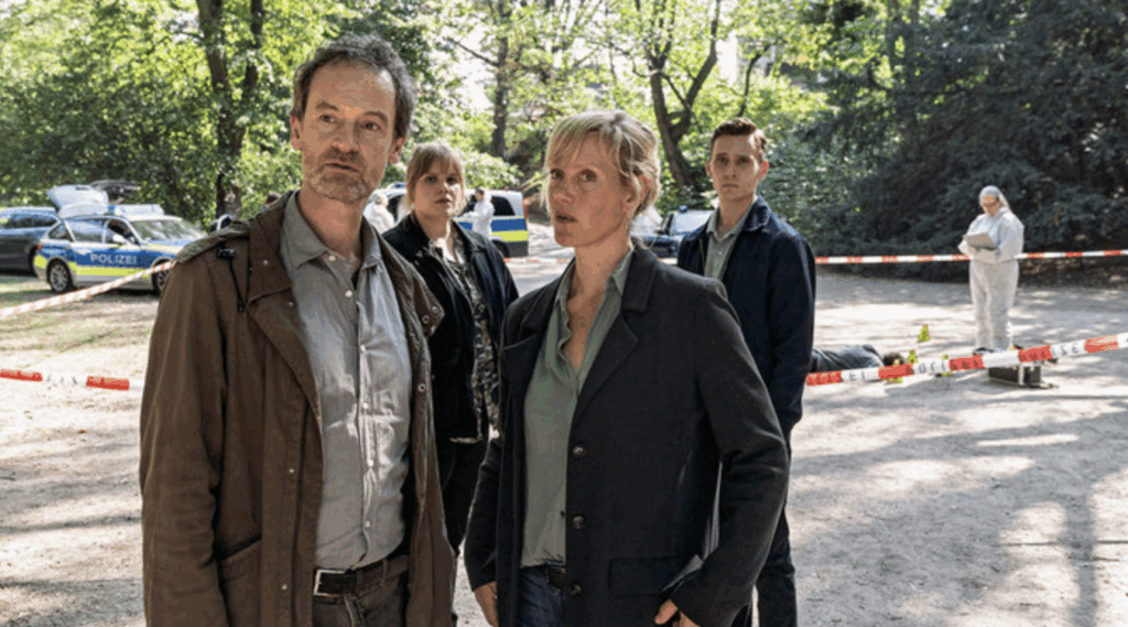 two commissioners from the police station standing at the crime scene